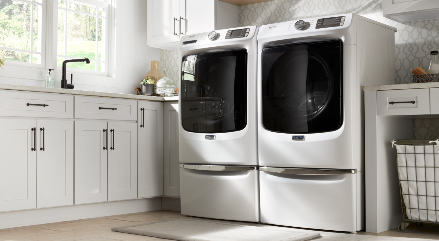White Maytag® front-load washer and dryer pair.