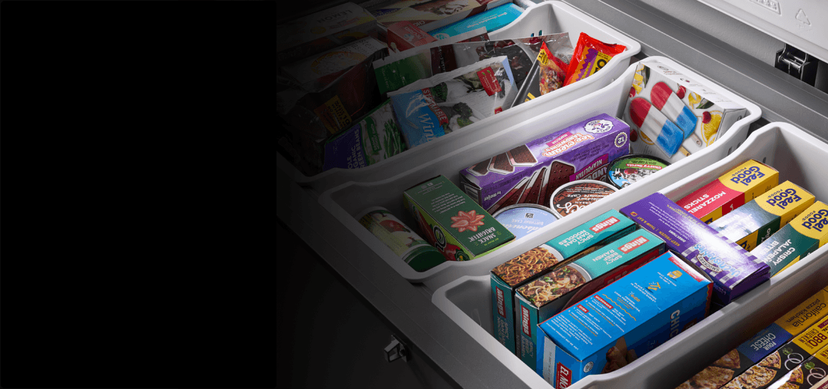 Frozen food inside a Maytag® chest freezer.