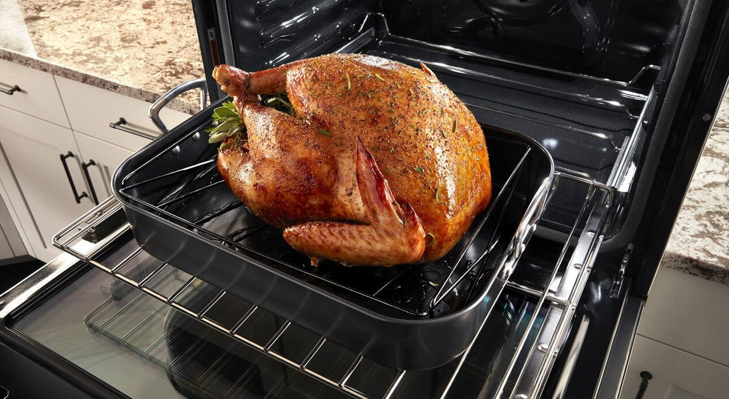 Large turkey going into the oven