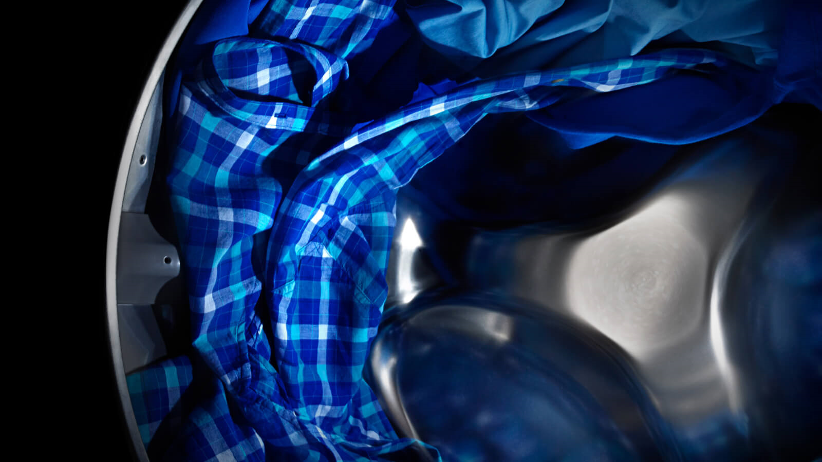 Maytag® dryer tumbling blue clothes