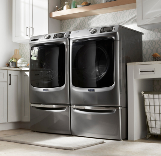 A Maytag® washer and dryer in a laundry room