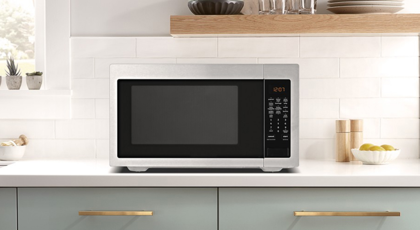 A countertop Maytag® microwave in a modern kitchen