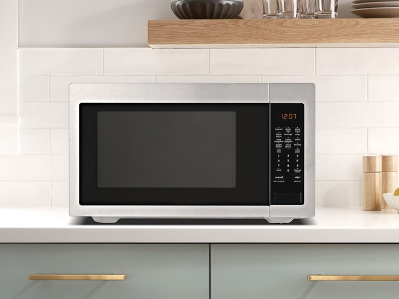 A countertop Maytag® microwave in a modern kitchen