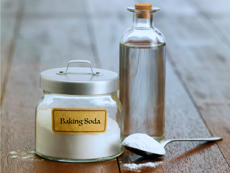 Baking soda and cleaning solution with a spoon