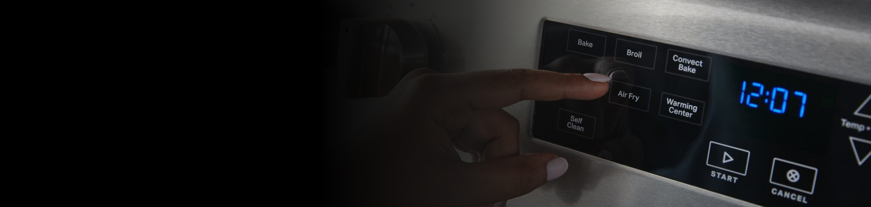 Person selecting the air fry button on a range