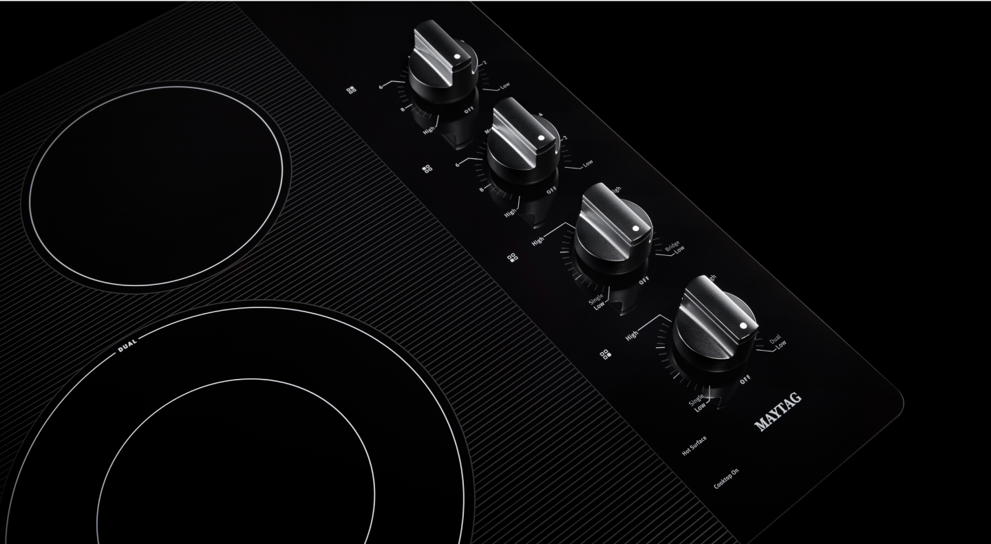 Glass electric cooktop burners and knobs