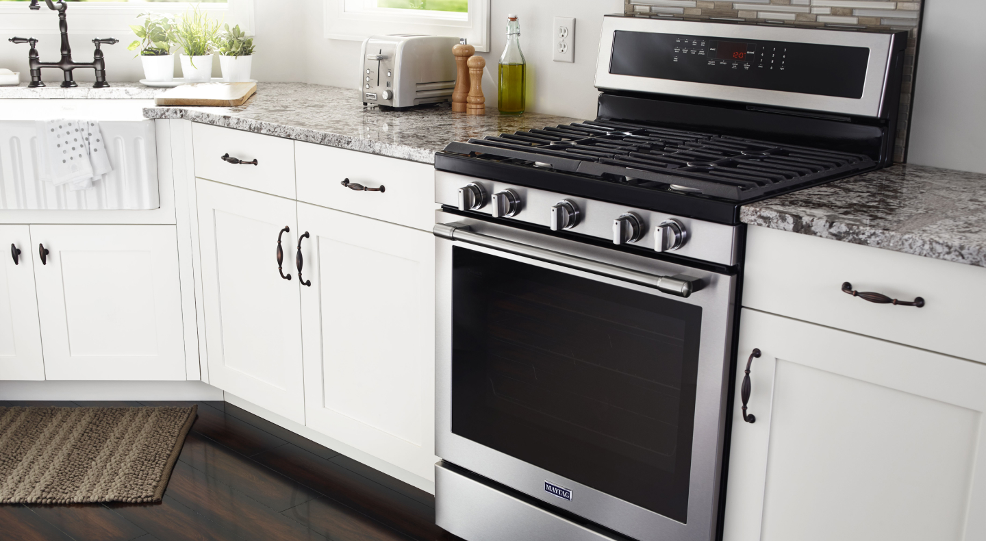 Interior shot of kitchen featuring Maytag® gas range.