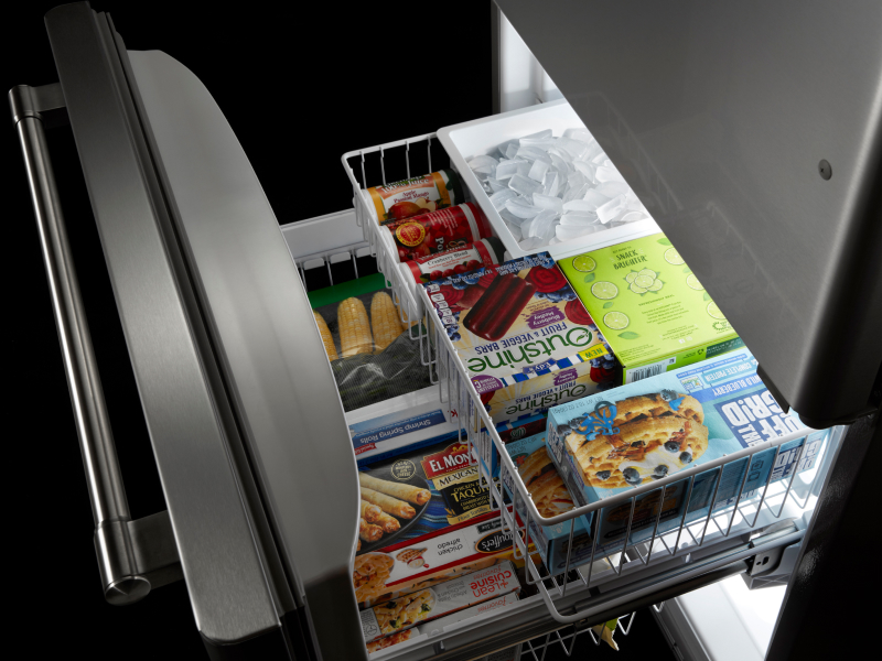 Bottom freezer open to show contents