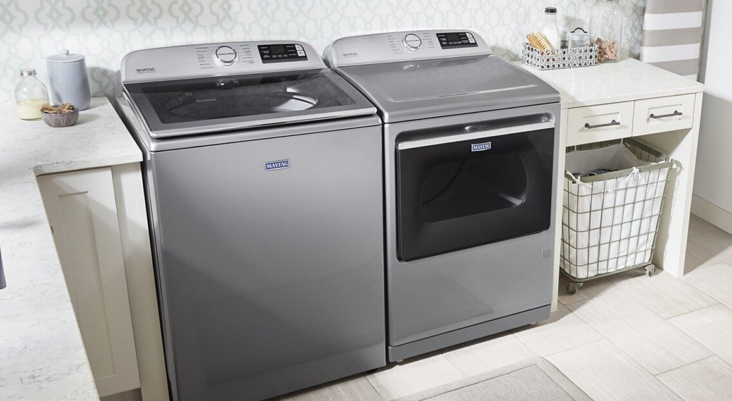 Maytag brand washer and dryer set in a laundry room