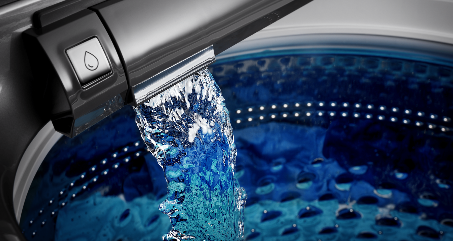 Water pouring into Maytag® washing machine