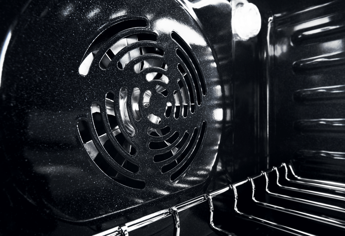 Closeup of the vent in back of the oven interior 