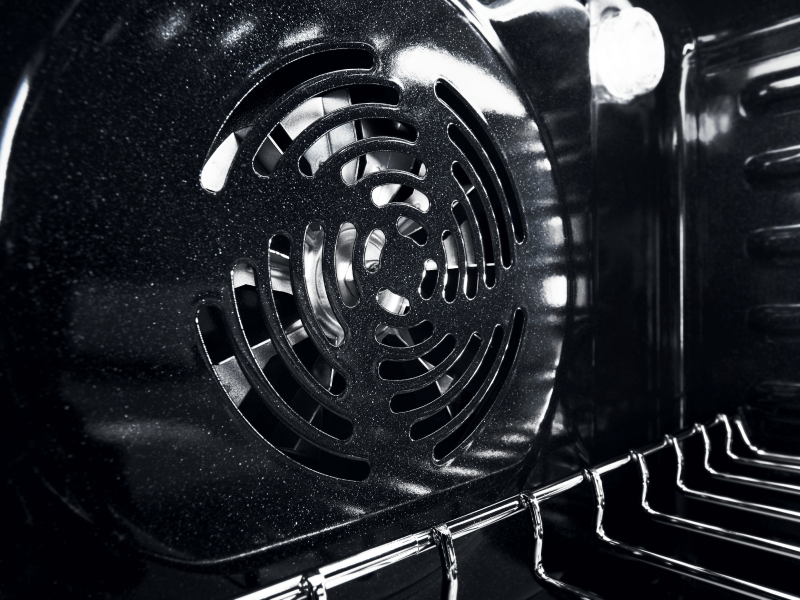 Closeup of the vent in back of the oven interior 