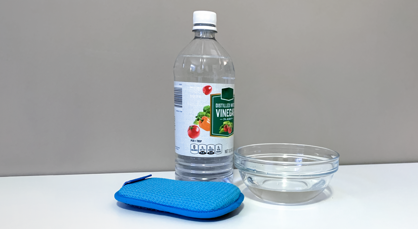 Cleaning your microwave with vinegar to remove burnt smells.