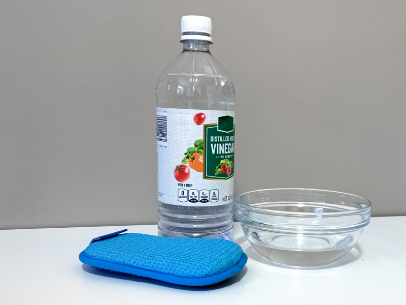 Cleaning your microwave with vinegar to remove burnt smells.
