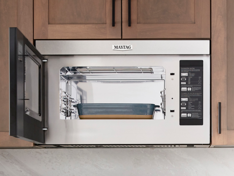 Stainless steel Maytag® appliances in a rustic kitchen