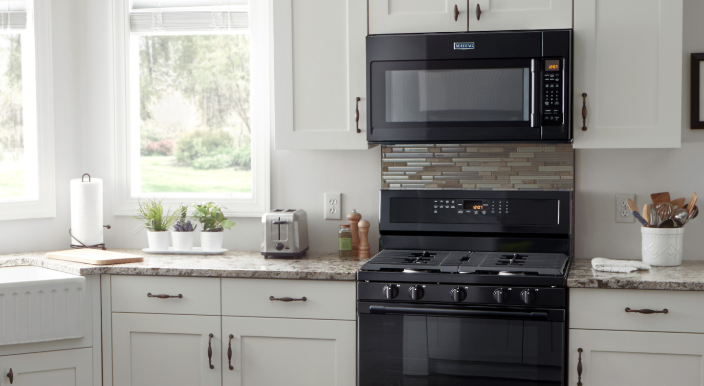 A Maytag® over-the-range microwave in a modern kitchen. 