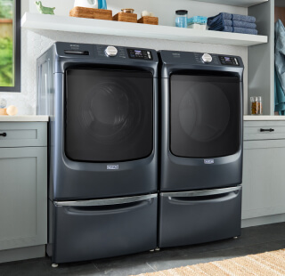 A Maytag® washer and dryer in a laundry room