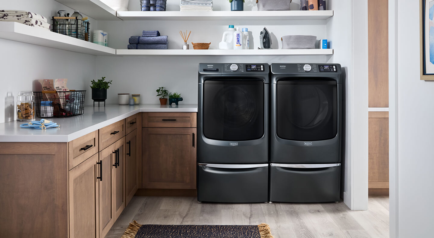 Maytag® washer and dryer set in a laundry room