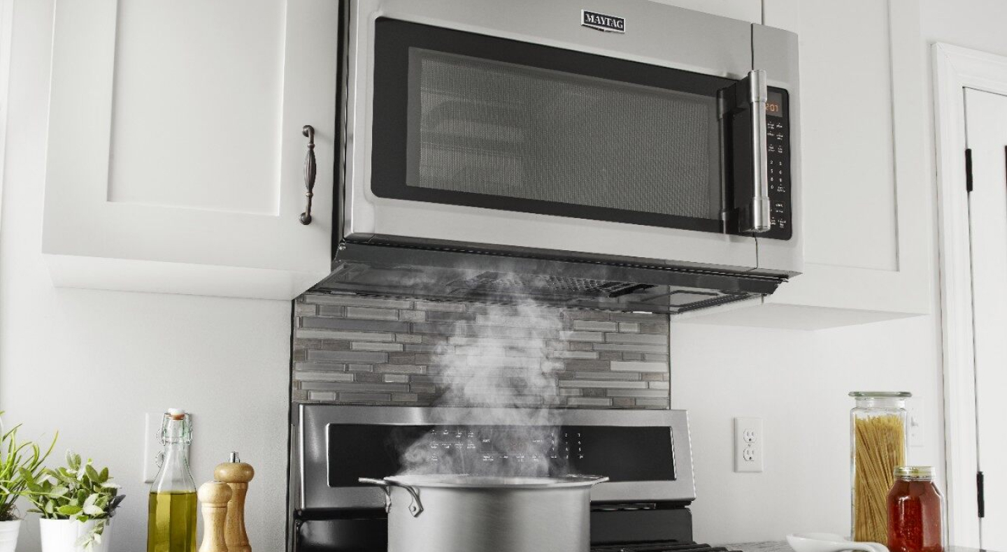 An over-the-range Maytag® microwave.