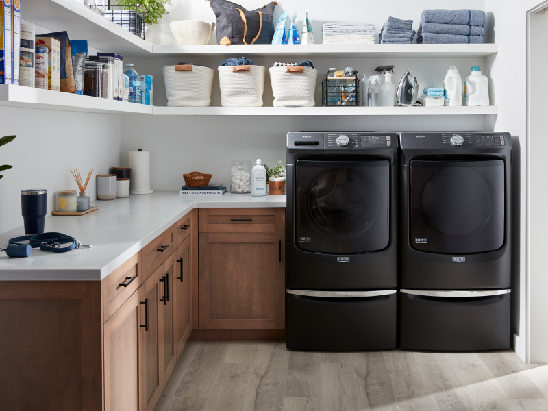 A laundry room featuring a Maytag® washer and dryer