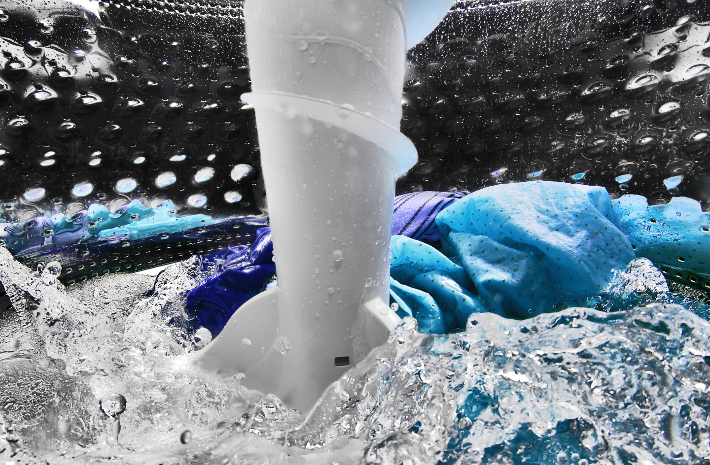 Clothing agitating inside of the washer with water