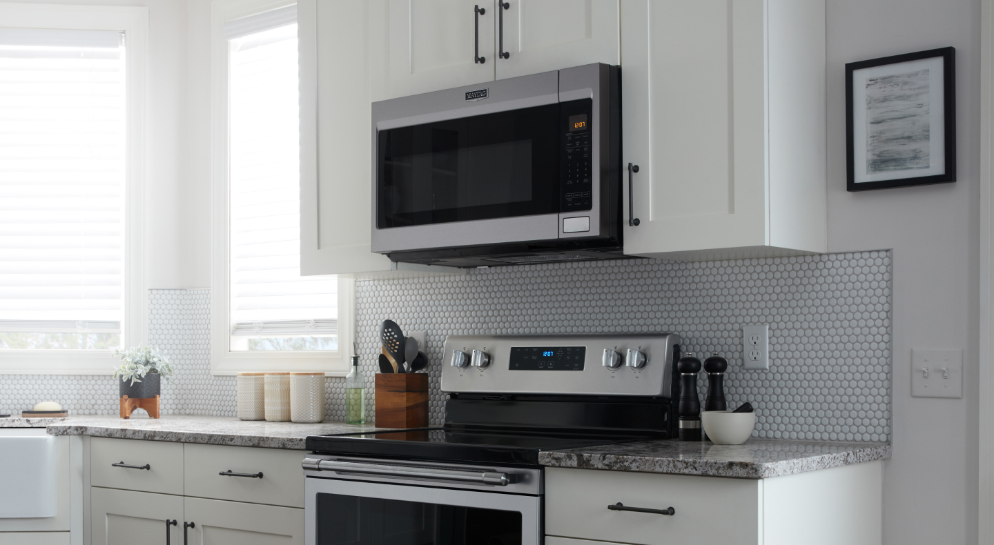 Closer view of Maytag brand stove and microwave