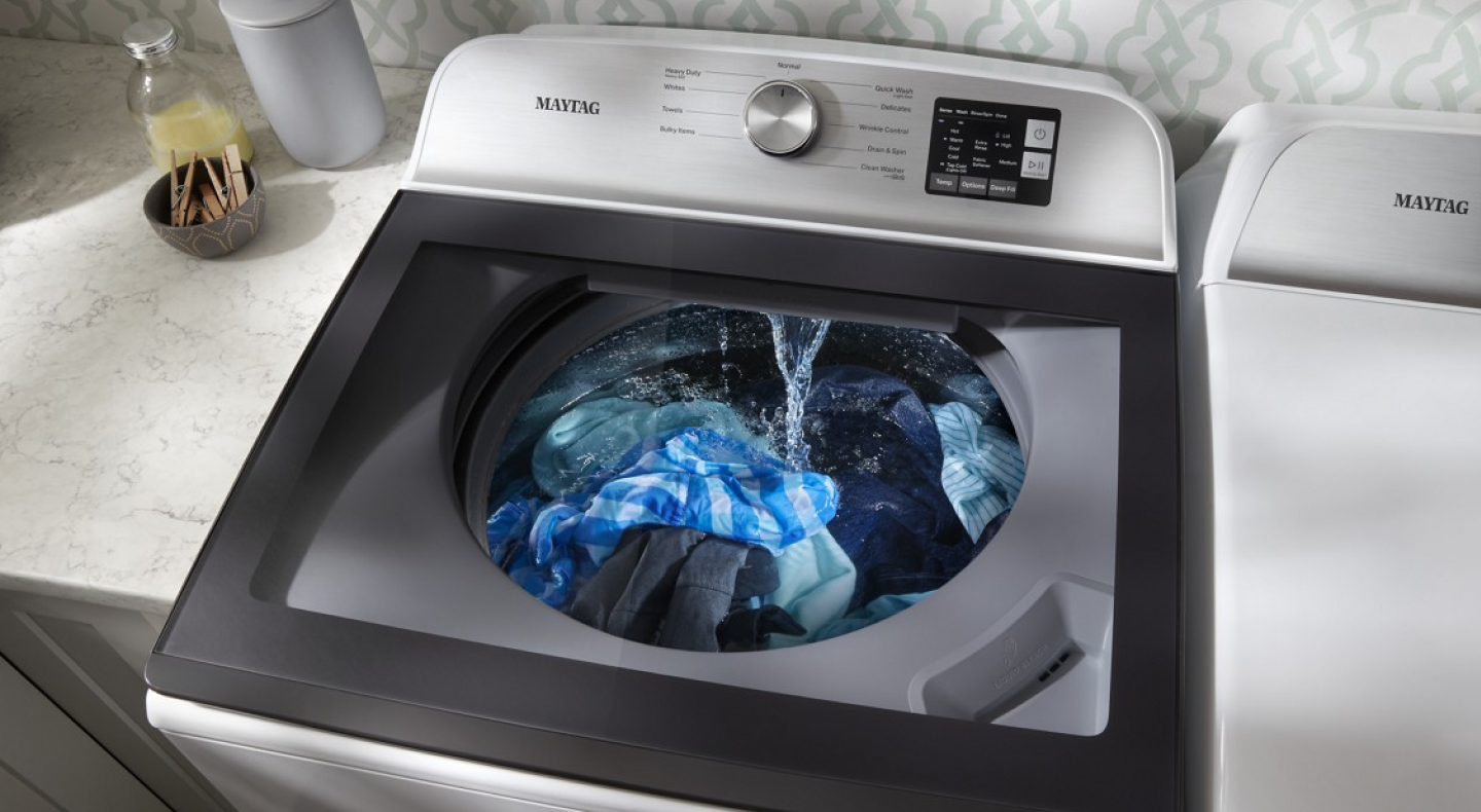 Washer with glass lid dispensing water