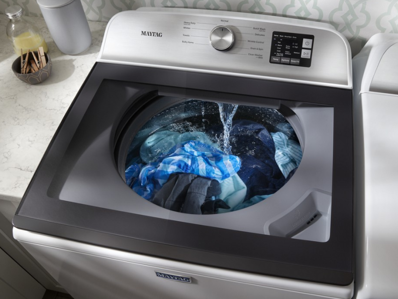 Washer with glass lid dispensing water