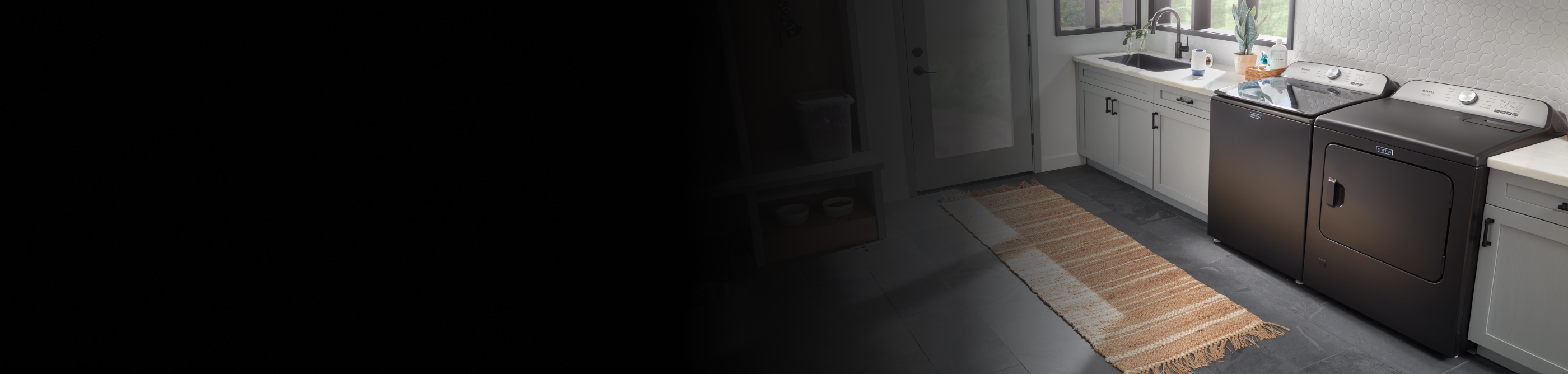 Grey washer and dryer in laundry room