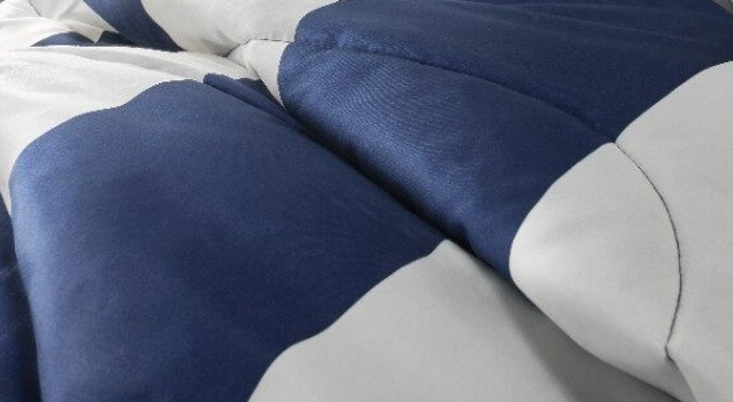 A closeup of an electric heated blanket.