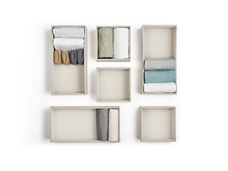 A set of folded items in boxes