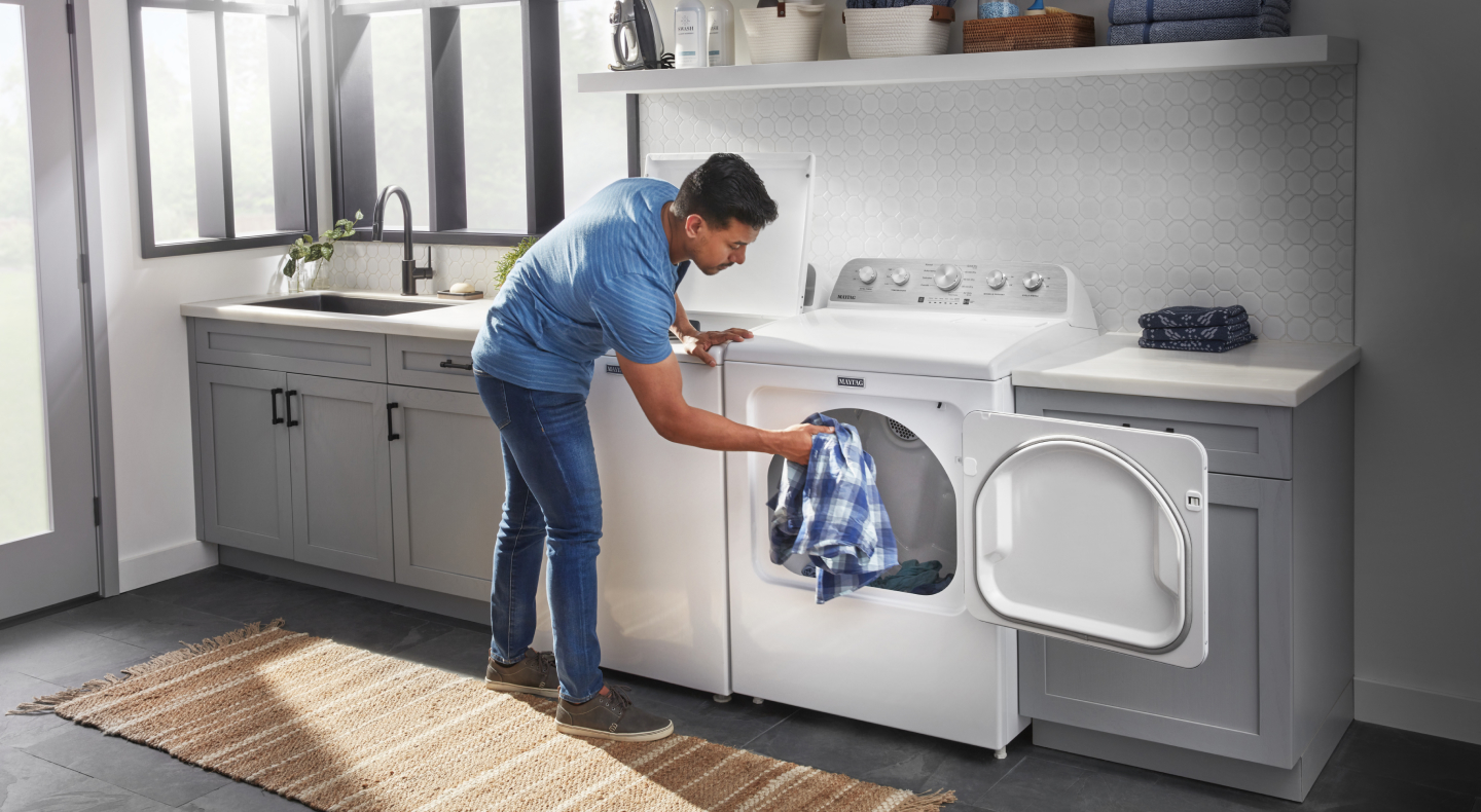 Placing clothes in a dryer