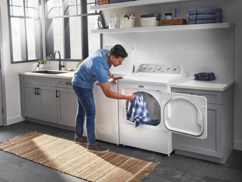 Placing clothes in a dryer