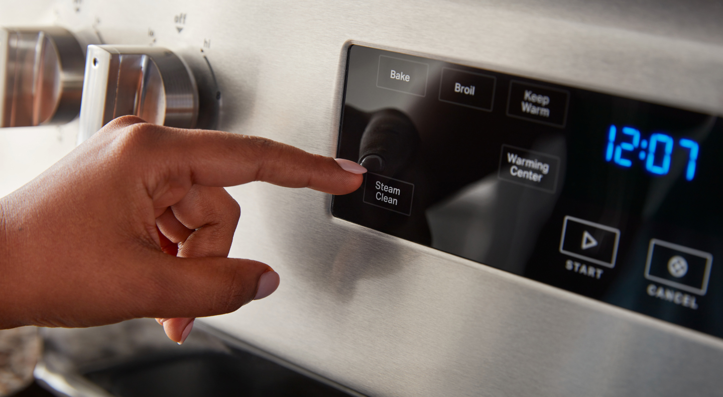 A person selecting a steam clean option