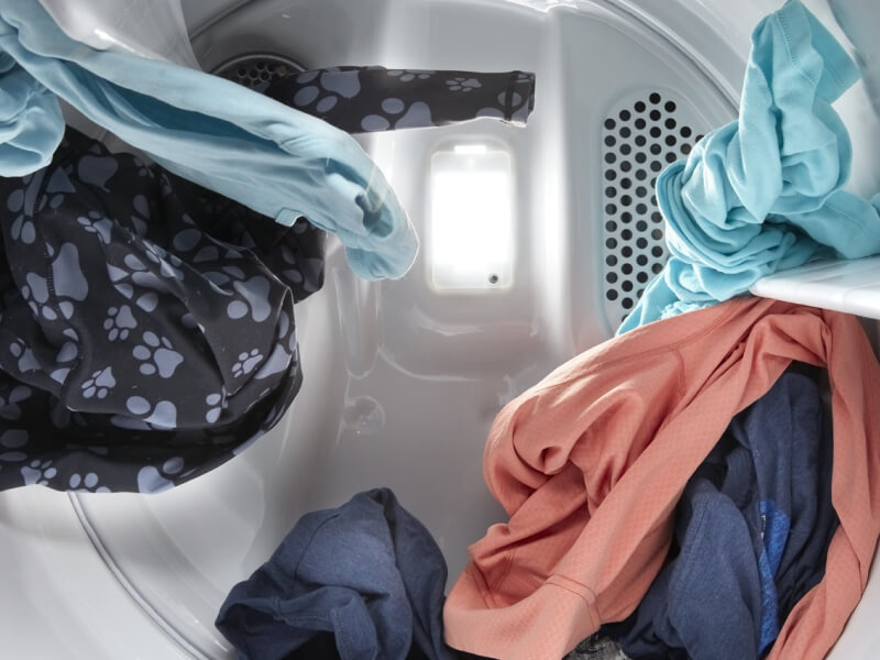 A closeup of clothes inside a dryer