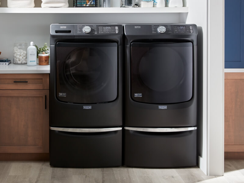 Washer and dryer set in a laundry room