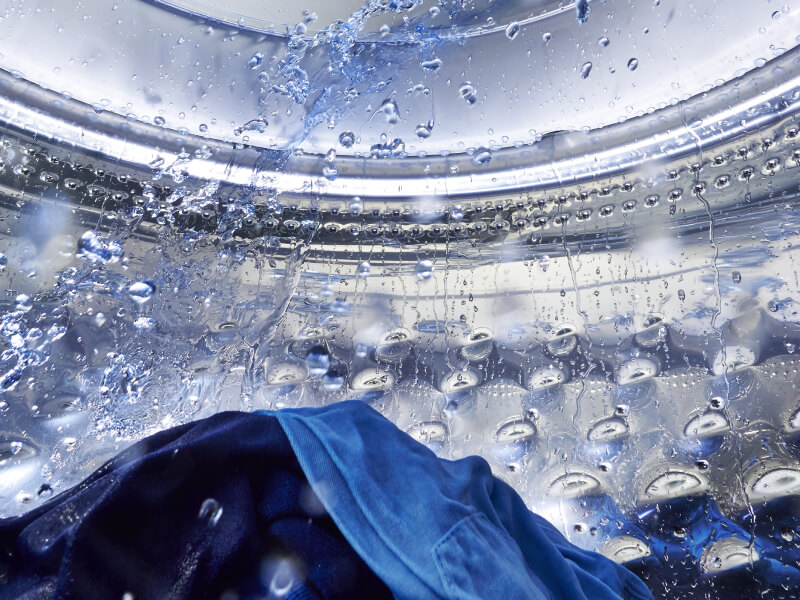 Water splashing in a Maytag® washing machine drum