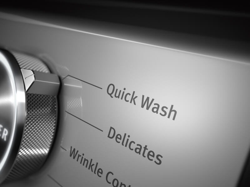A closeup of the Quick Wash setting on a Maytag® washer
