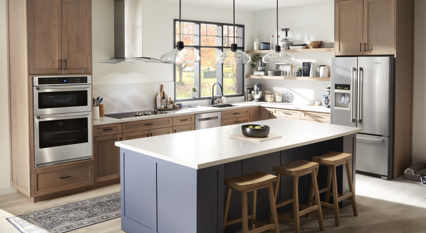 Large kitchen with an island in a work zone layout