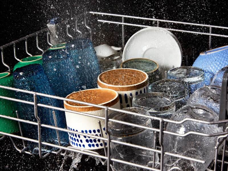 Dishes getting clean in a dishwasher