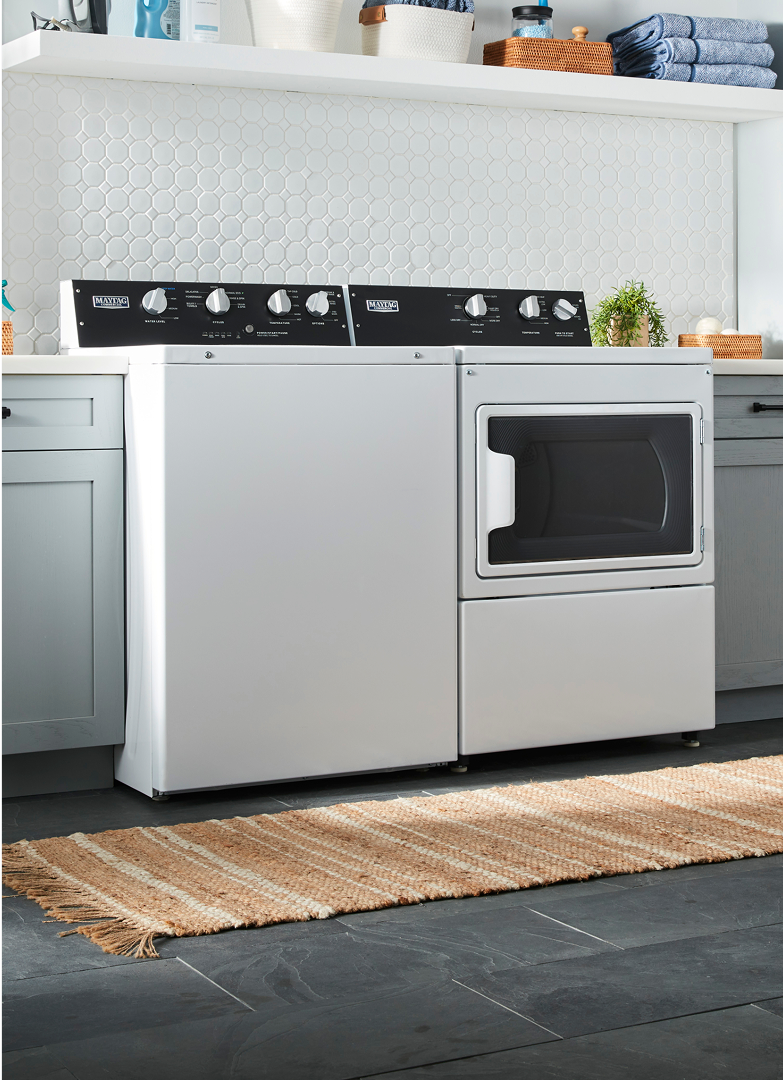 Commercial-grade washer and dryer in a home laundry room.