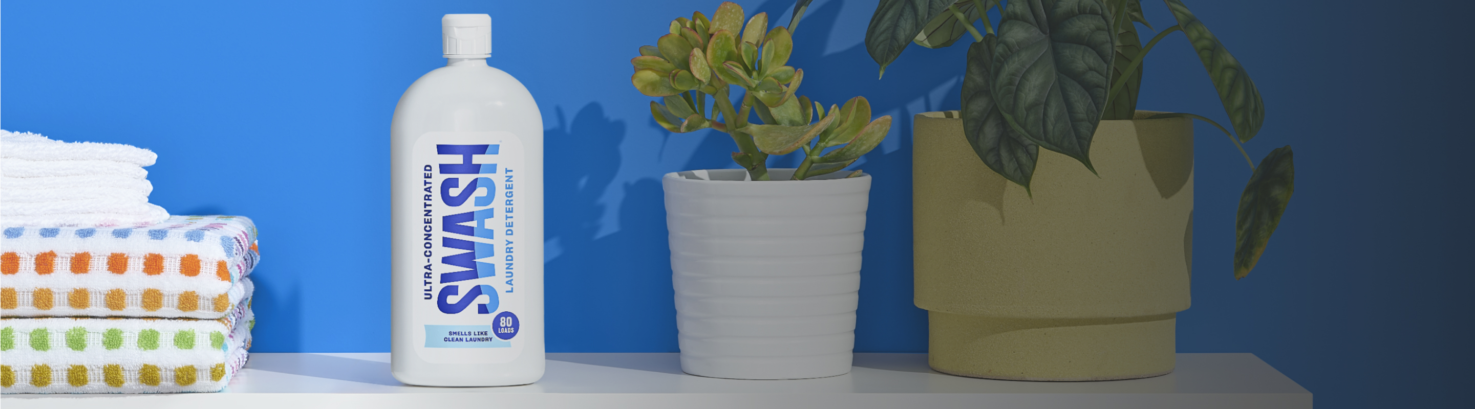 Three bottles of Swash® Laundry Detergent.