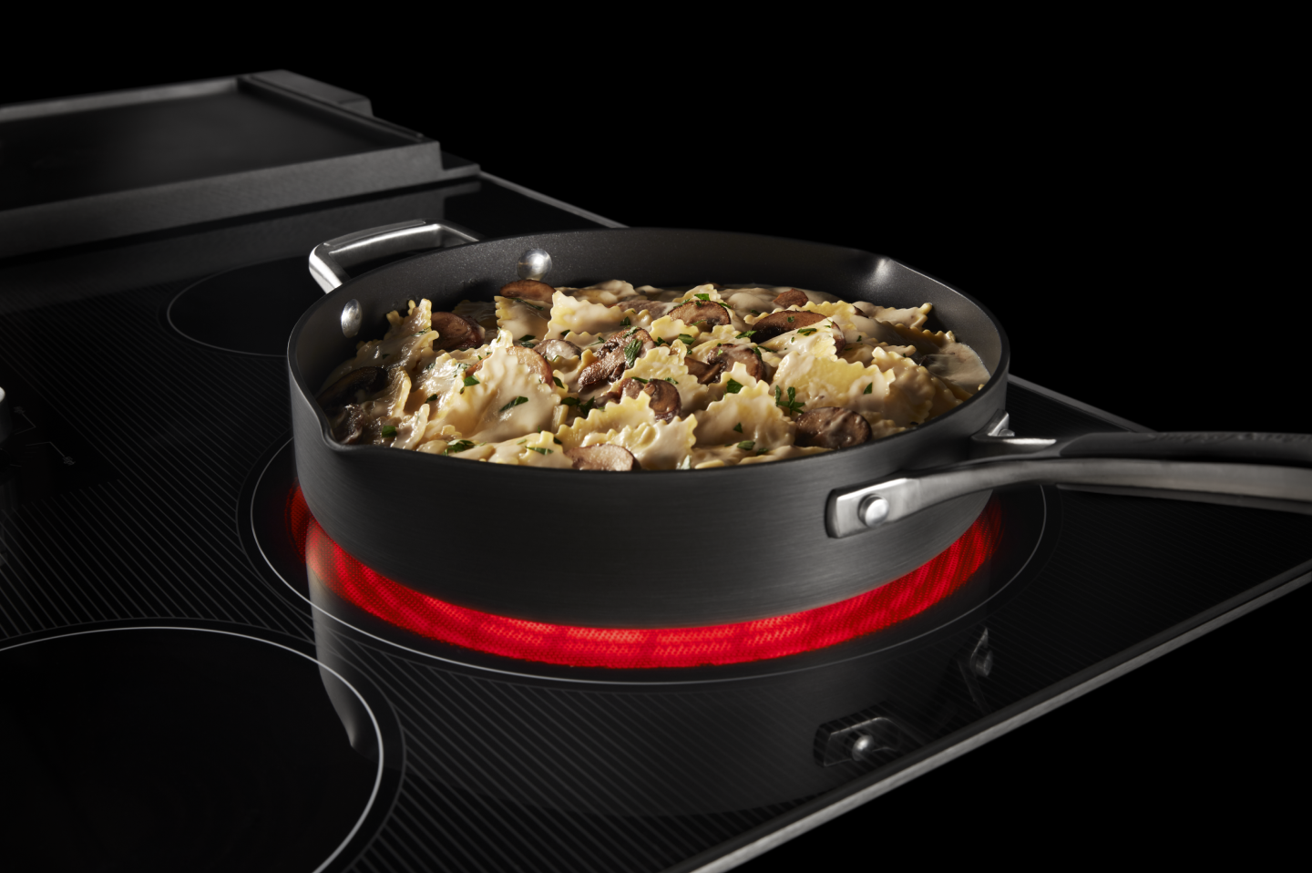 Cooked pasta in a pan on a Maytag® induction cooktop