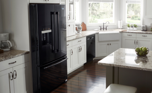 Black Maytag® French door refrigerator in a kitchen with white cabinetry