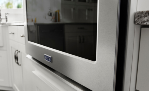 Maytag® Combination wall oven in a white kitchen