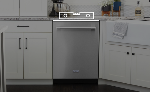 Maytag® dishwasher in a kitchen with a level on top.