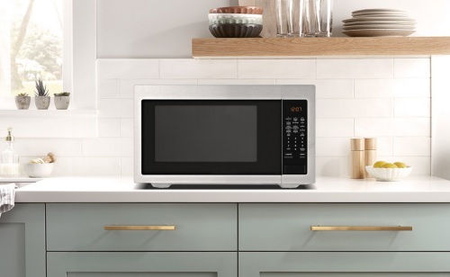 Stainless steel microwave on a countertop