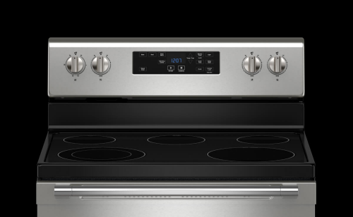 A Maytag® electric stove on a black background