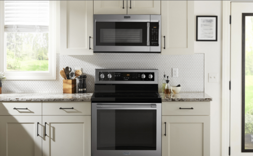 A microwave installed above an oven