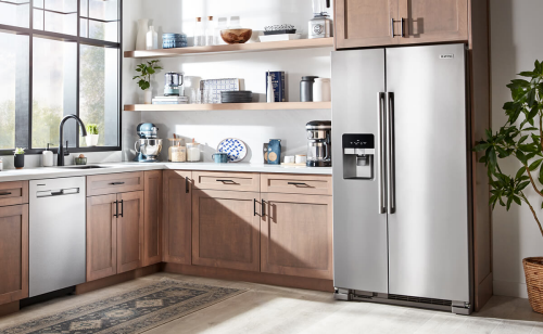 Maytag® appliances set in light brown cabinetry